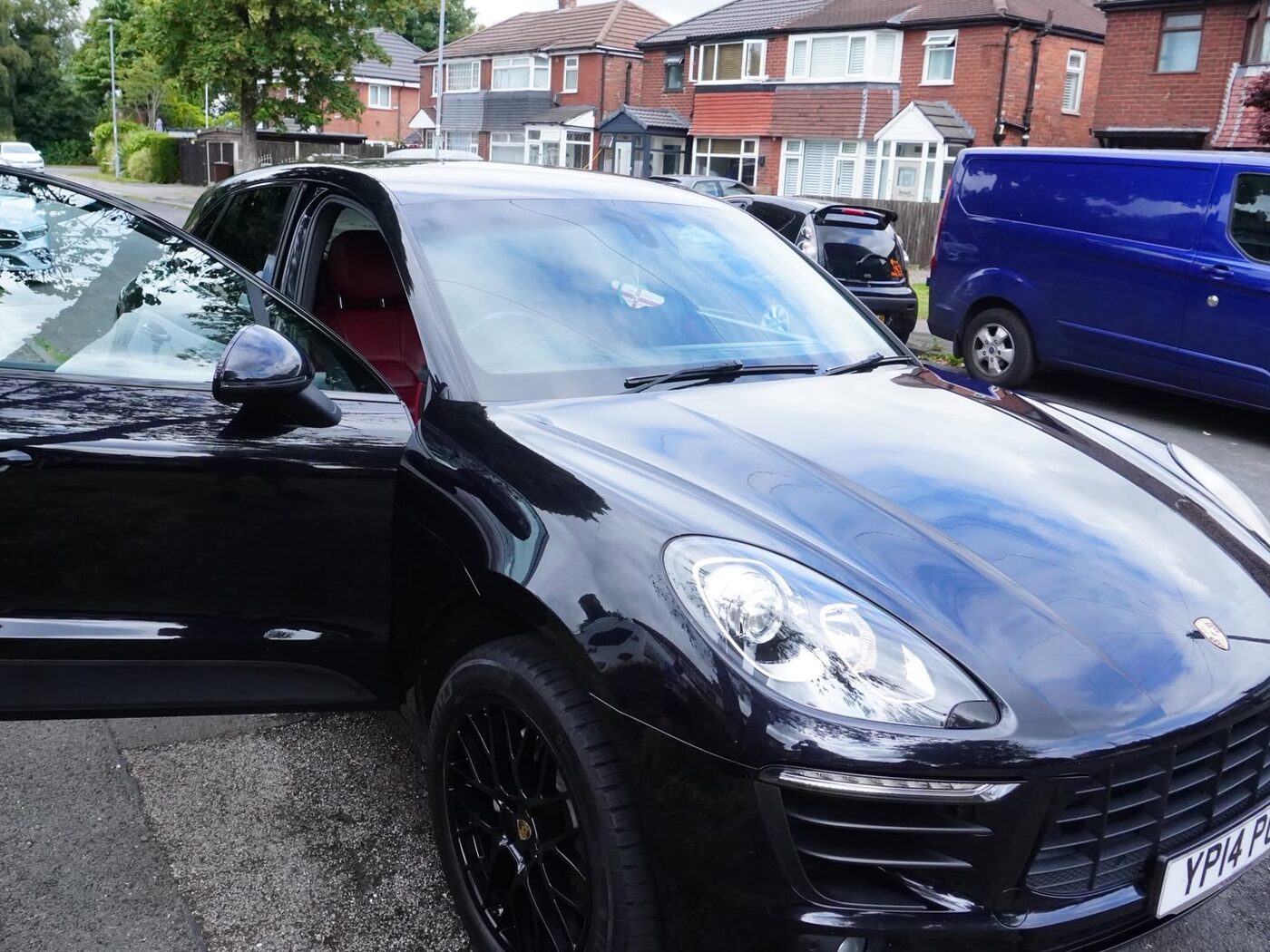 Porsche Macan after a maintenance valet — deep gloss finish