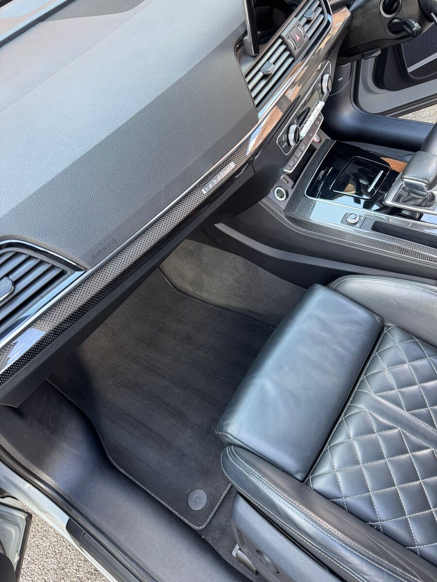 The same footwell cleared and vacuumed