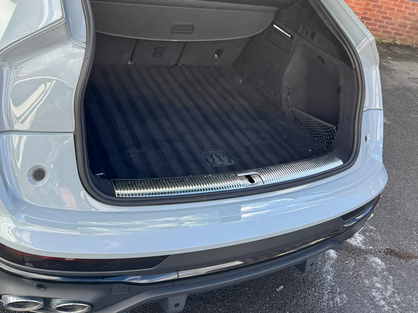 Audi estate boot after a maintenance valet — vacuumed and dressed